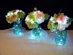 Fairy Lighted Table Centerpieces I Made 16 Of These For An Outdoor Wedding Walkway Wedding Centerpieces Flower Centerpieces Wedding Wedding Centerpieces Diy