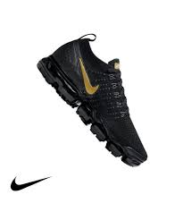 The plush cushioning system is tinted in a metallic gold hue, matching the tpu midfoot shank and branding hits up top. Nike Air Vapormax Flyknit 2 Black Metallic Gold Women S Shoe Main Container Image 1 Black Nikes Nike Air Vapormax Flyknit Nike Air Vapormax