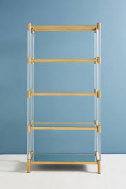 And most of the time, besides having a light or a chair, the space virtually goes unused. Oscarine Lucite Mirrored Brass Bookshelf