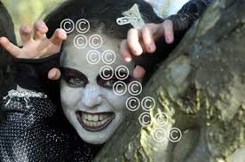 26250711-Crookston Castle Pr teacher Sarah-Jane Caldwell with the pupils  from her school who worked in the book Droopy Discovers Europe. Sarah Jane  and Demi Sheldon 9 have a close look at the