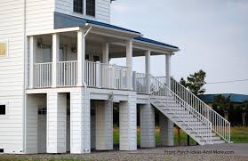 Waterfront beach house exteriors often have hurricane shutters to protect your windows from the elements. Beach Home Plans Coastal Houses Front Porch Pictures Beach Houses