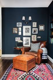 Traditional brown living room in rich tones, refined wood and blue draperies to make the room look fresh. Navy Walls For Your Home Home Decor Home Living Room Inspiration