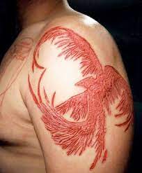 Scarification can also consist of removing strips of flesh so that the scars are in a shape of a picture scarification is a form of extreme and permanent body modification. Beautiful Phoenix Skin Scarification On Shoulder Scarification Scarification Tattoo Body Modifications