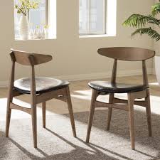 Baxton Studio Flora Black Faux Leather And Medium Brown Wood Dining Chairs Set Of 2 2pc 6942 Hd The Home Depot Oak Dining Chairs Mid Century Dining Chairs Wood Dining Chairs