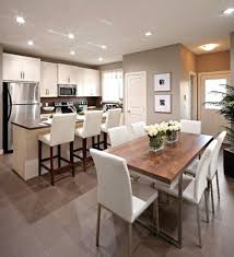 The kitchen is opposite the living area, in a large, open space that automatically lends itself to entertaining and family living. Open Kitchen Dining Room Living Room Ideas Ecsac