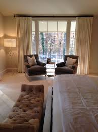 We come into the living room off of a center hall and ahhh, into my favorite of all conversation groupings ever. Chair In Front Of Bed And By Windows Modern Master Bedroom Bedroom Seating Bed Design