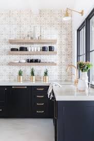 Black And Gold Kitchen Cabinets Modern Kitchen With Black Kitchen Cabinets And Quartz Counters And Gold Faucet Farmhouse Kitchen Backsplash Accent Wall In Kitchen Kitchen Backsplash Designs
