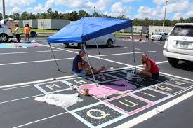 Applied to the wet paint parking lot, forgetting to buy grit means the paint has time to dry! The Stampede Senior Parking Spot Painting At The Ranch