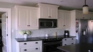 White shaker cabinets and subway tile backsplash and black countertop with brown wood floor. Kitchen Ideas With White Cabinets And Black Countertops Youtube