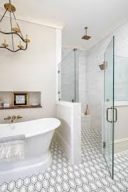Floor Level Shower With White Gray And Black Geometric Floor Tiles Featuring A Zero Entry Glass Enclosed In 2020 Geometric Floor Glass Shower Doors Shower Floor Tile