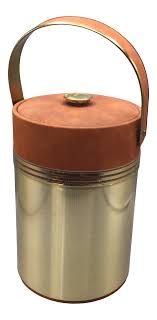 Rather than rushing back to the freezer for ice cubes, store them right on the bar cart with an ice holder. Georges Briard Egyptian Motif Insulated Brown Swede Ice Bucket Chairish