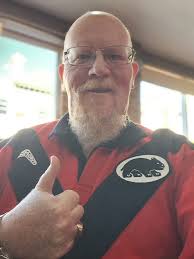 Young men eating lunch in pocket Park with Elbert Hubbard