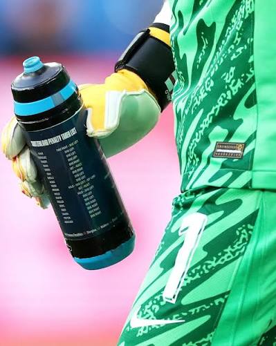 close-up of Mr. Pickford's water bottle showing a cheat sheet with plays linked to different opposing team players