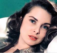 Janet Leigh looking a bit different. With the dark hair I see a strong  resemblance to Grace Kelly.