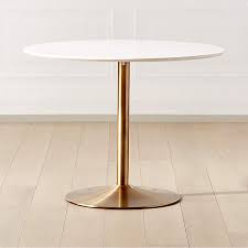 The table top of our lucy bistro table (42002/gold) is constructed using mdf with a while marble paper laminate. Odyssey Brass Dining Table Reviews Cb2