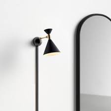 I'm wanting sconces that are hardwired into the wall, but also include at least one electrical outlet on the hey friends! Modern Contemporary Plug In Wall Sconce With Cords Allmodern