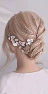 The wavy high bun is just adding more glam to the outfit. Bridal Hairstyles That Perfect For Ceremony And Reception Twisted Bun