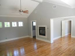 Dark Brown Wooden Color Laminate Flooring With Grey Walls In 2020 Living Room Wood Floor Oak Wood Floors Grey Walls