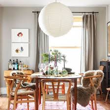 In this dining room from home.at.goldlay, a cool light gray acts as the canvas for bold oranges, yellows, and reds throughout the space. 40 Best Dining Room Decorating Ideas Pictures Of Dining Room Decor