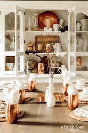 Transform your dining room table with fun and colorful table decorations, like candle holders, table vases, napkin rings, candles, and other decorative objects. Copper Decor Accents In My Dining Room Marly Dice