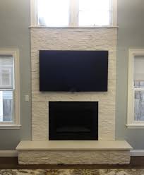 white stone fireplace finished nor stone fireplace with mounted tv in lexington ma white stone fireplaces modern fireplace tv above fireplace