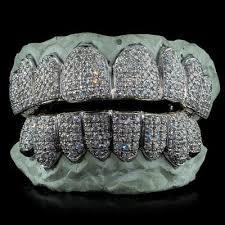 Call today for free shipping on all orders over $99 Diamond Teeth Custom Grill Grillz