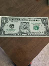 Photo of happy santa claus with dollar bills and cabbage looking at camera. A Santa Clause Dollar Bill The Santa Part Can Peel Away To Reveal An Authentic Bill Interestingasfuck