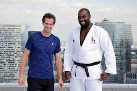 Then his deep voiced, tall and pale persona showed up on tv and films in 1990. Andy Murray Shows Height Of His Success As He Grapples With Judo Champ Teddy Riner On Top Of Paris Skyscraper