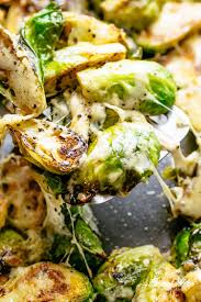 Cheesy Garlic Roasted Brussels Sprouts Recipe Caramelized And Topped With Melted Mozzare Brussel Sprout Recipes Roasted Brussels Sprouts Recipe Brussel Sprouts