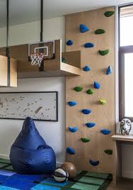 So why not give them one they are allowed to climb? A Fun Kids Bedroom With A Loft Bed And Rock Climbing Wall