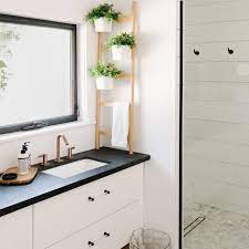 The faucets extend from the wall, adding a modern element in it. 15 Modern Farmhouse Bathrooms