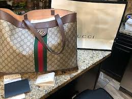 Crafted in gg supreme canvas with inlaid green and red web stripe, the accessory is enhanced by a petite play on the double g, an archival gucci code from the '70s that appears atop a. Gucci Ophidia Medium Soft Gg Supreme Canvas Tote Bag Off 73 Buy