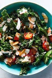 Warm Kale Coconut And Tomato Salad Recipe Nyt Cooking Tomato Salad Recipes Recipes Warm Kale Salad