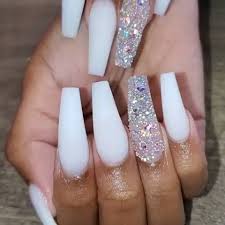 • coffin shaped acrylic nails are similar in shape to ballerina and stiletto shapes, but with a squared tip. Frosted White Coffin Nails With Glitter Coffin Frosted Glitter Na White Acrylic Nails With Glitter Acrylic Nails Coffin Glitter Long Acrylic Nails Coffin