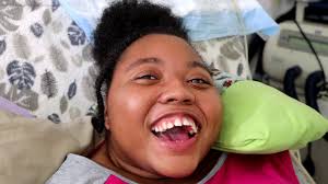 Navia is a nonspeaking quadriplegic with an intellectual disability. She is  cared for by her loving single mom, Shanta. Navia lights up around people  and loves connecting with others, but the two
