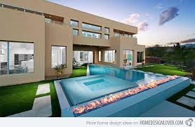 Maybe you would like to learn more about one of these? 15 Dramatic Modern Pool Areas With Fire Pits Home Design Lover Modern Pools Swimming Pool Designs Backyard Pool Designs