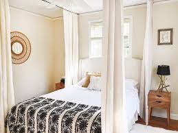 This sections off your bed without sacrificing space. How To Hang A Canopy From The Ceiling Without Drilling Holes Hunker Bedroom Wall Decor Above Bed Canopy Bed Diy Wall Decor Bedroom