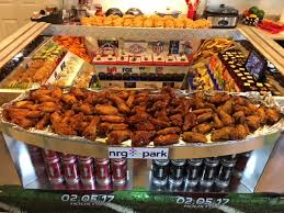These stadiums of hors d'oeuvres really put the super in super bowl snacks. Food Stadium Bobotie