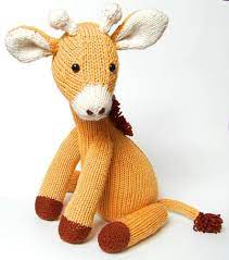 This cute little giraffe hat knitting pattern is a fun and easy knitting project for babies and toddlers! Jasmine The Giraffe Knitting Pattern By Penny Connor Knitting Patterns Loveknitting Giraffe Pattern Animal Knitting Patterns Knitting Patterns