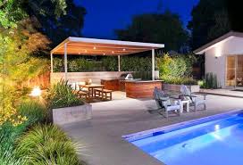 An open design is becoming increasingly popular for kitchens. Modern Outdoor Kitchen Designs With Beautiful Dining Areas Under Roofs