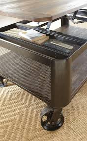 A lift top pulls up to reveal hidden storage space, and casters on the base let you move the table about with ease. Barrow Lift Top Cocktail Table W Casters Cleo S Furniture