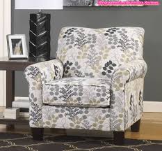Gentle, sloping arms highlight this sophisticated accent chair. Floral Patterned Fabric Accent Arm Chair