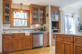 Rustic Red Oak Cabinets With Upper Glass Front Cabinets And Stainless Steel Appliances We Al Kitchen And Bath Remodeling Custom Kitchens Glass Front Cabinets