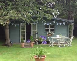 Summerhouse Painted In Cuprinol Garden Shades Walls Wild Thyme Windows Sage And Natur Painted Garden Sheds Cuprinol Garden Shades Garden Front Of House
