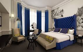 Rich navy curtain on a deep blue wall. 15 Blue Drapes And Curtain Ideas For A Stunning Modern Interior