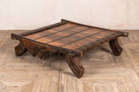 It is made of stone, resin, and a glass top. Moroccan Coffee Table Peppermill Interiors