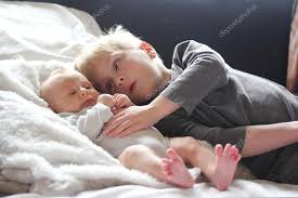 Big Brother Lovingly Playing With Newborn Baby Sister Stock Photo By C Christin Lola 68342423