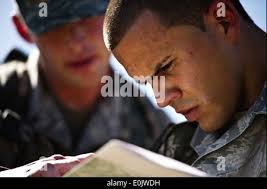 United States Army Sergeant Daniel Tores displays his dog tags and bullets  around his neck at the annual Memorial Day commemoration ceremony at the  Intrepid Sea, Air & Space Museum in New