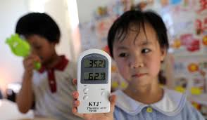 Residents in Hong Kong's poorest neighbourhoods struggle to keep cool as  city endures another day of record long May heatwave