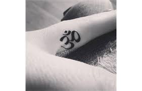 33 Awesome Minimalist Tattoos Every Yogi Will Want Inked Finger Tattoos Om Tattoo Yoga Tattoos